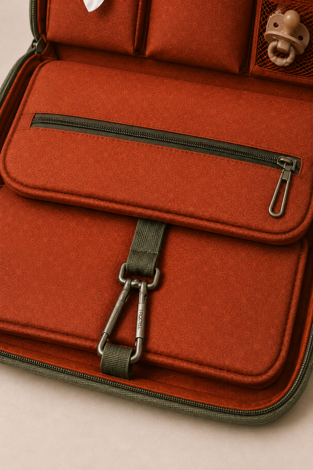 Lower panel zip pocket and carabiner strap — interior detail
