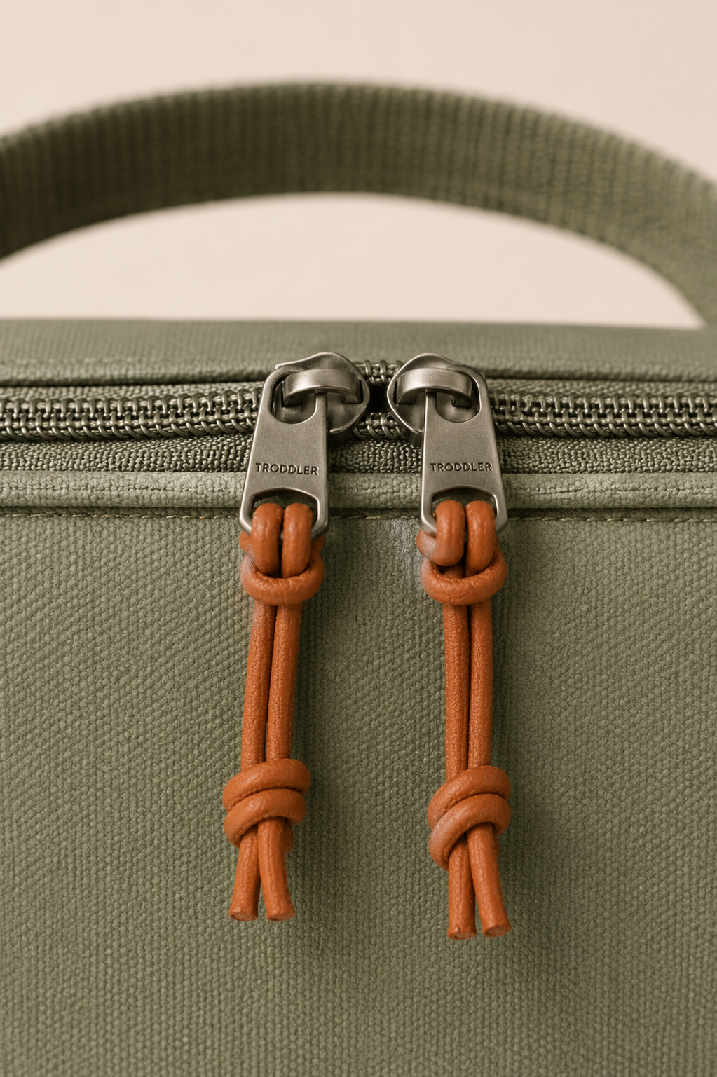 Knotted leather zip pulls — detail